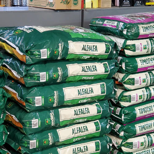 Stacks of green bags labeled 
