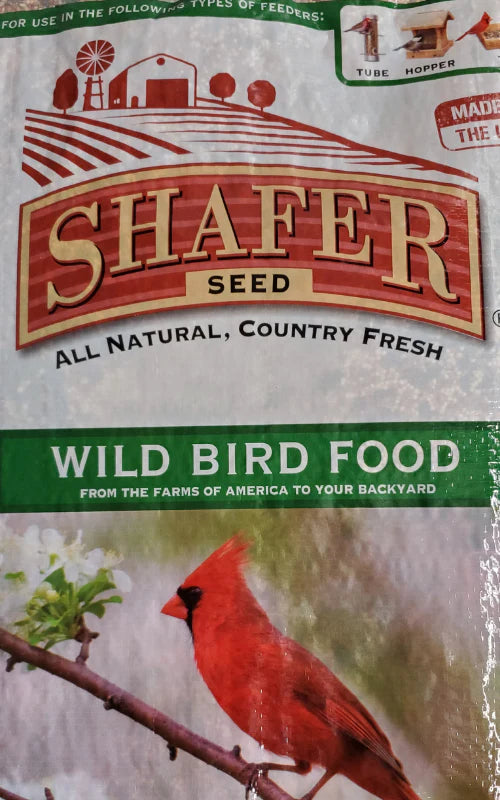 Packaging of Shafer Seed Wild Bird Food featuring a red cardinal perched on a branch. The design conveys a natural, country-fresh theme.